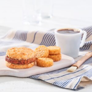 A Bojangles biscuit sandwich, hash brown bites, and a coffee